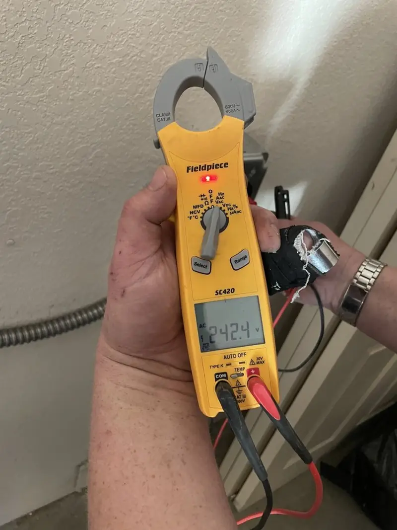 Voltage testing with clamp meter during Generator Installation in Helena Valley Southeast